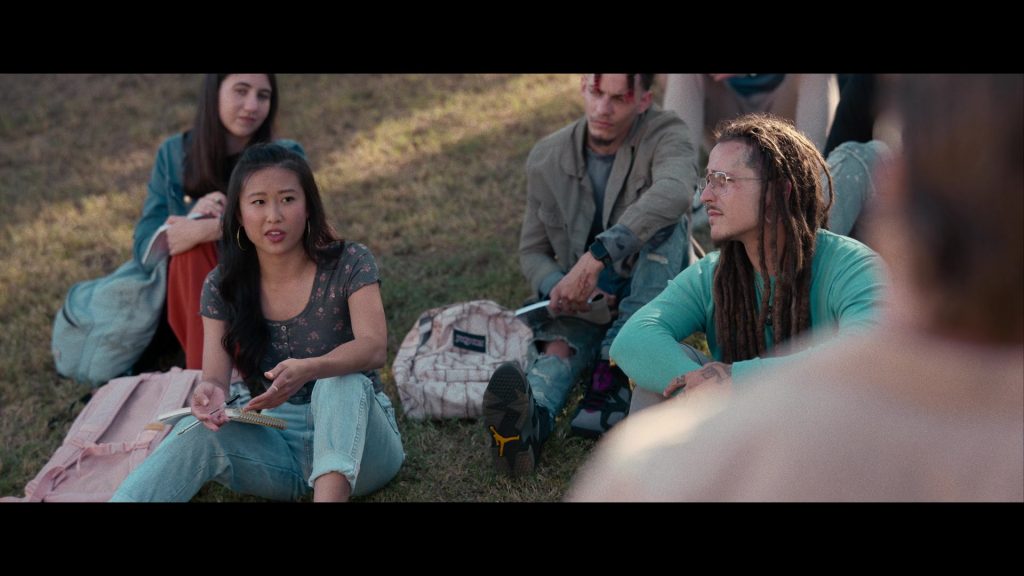 Nike Air Jordan Sneakers and JanSport Backpack in Hit Man (2023) (Image 4)