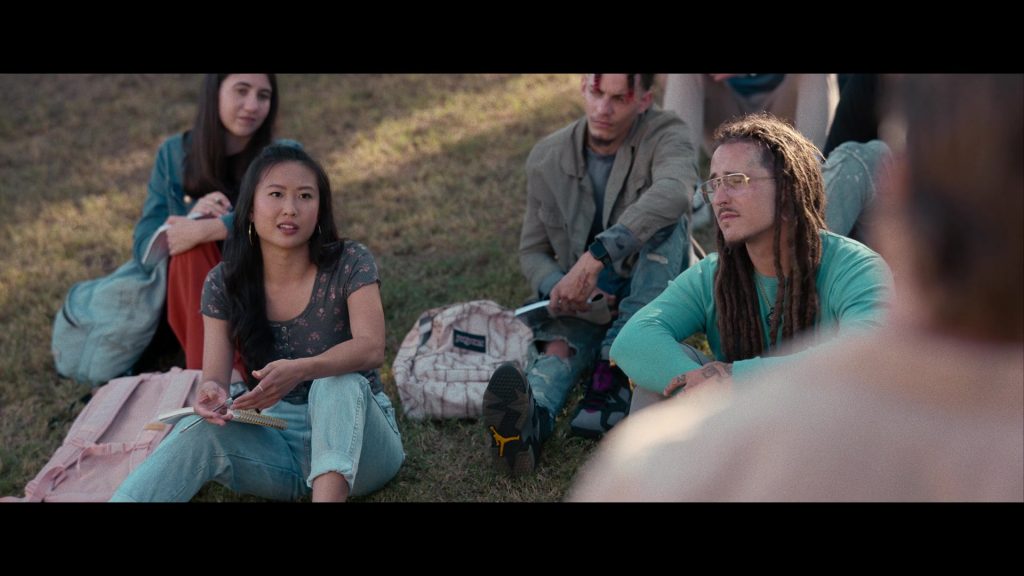 Nike Air Jordan Sneakers and JanSport Backpack in Hit Man (2023) (Image 5)