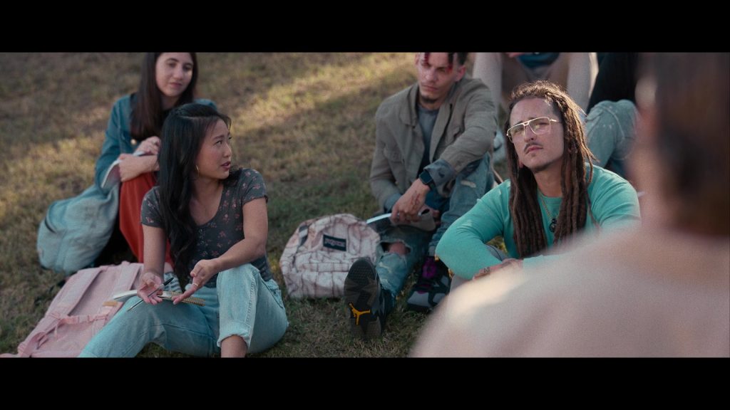 Nike Air Jordan Sneakers and JanSport Backpack in Hit Man (2023) (Image 9)
