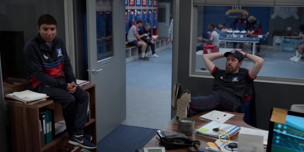 Nike Flex Contact Blue Sneakers Worn by Nick Mohammed as Nathan in Ted Lasso S01E05 “New Underwear” (2020) (Image 1)