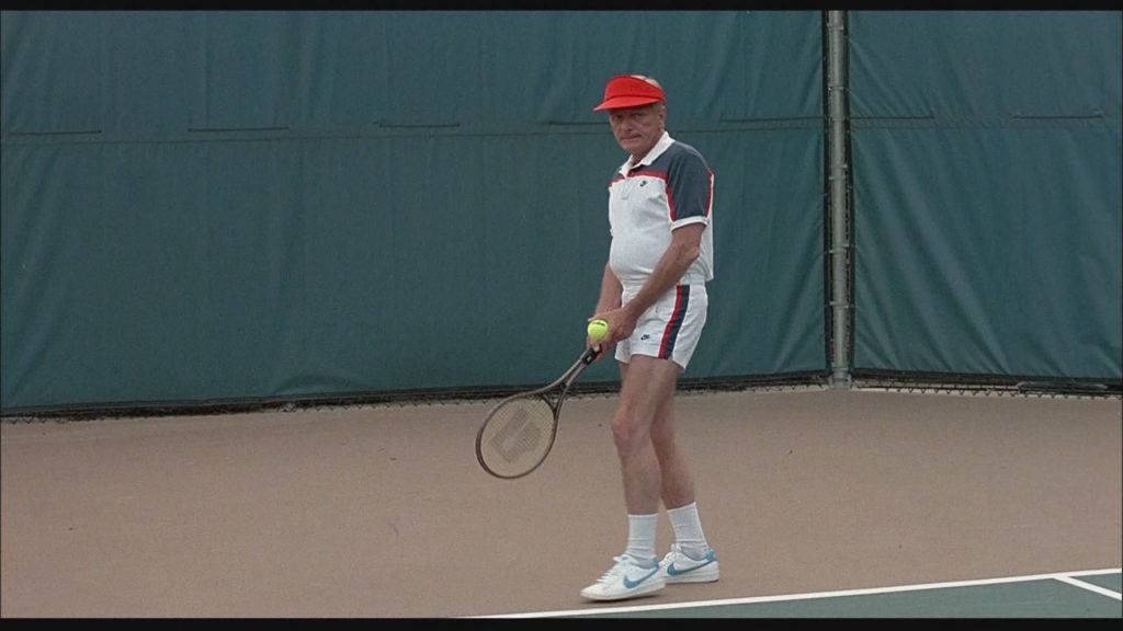 Nike Shirt, Men's Shorts and Sneakers in Bachelor Party (1984) (Image 1)