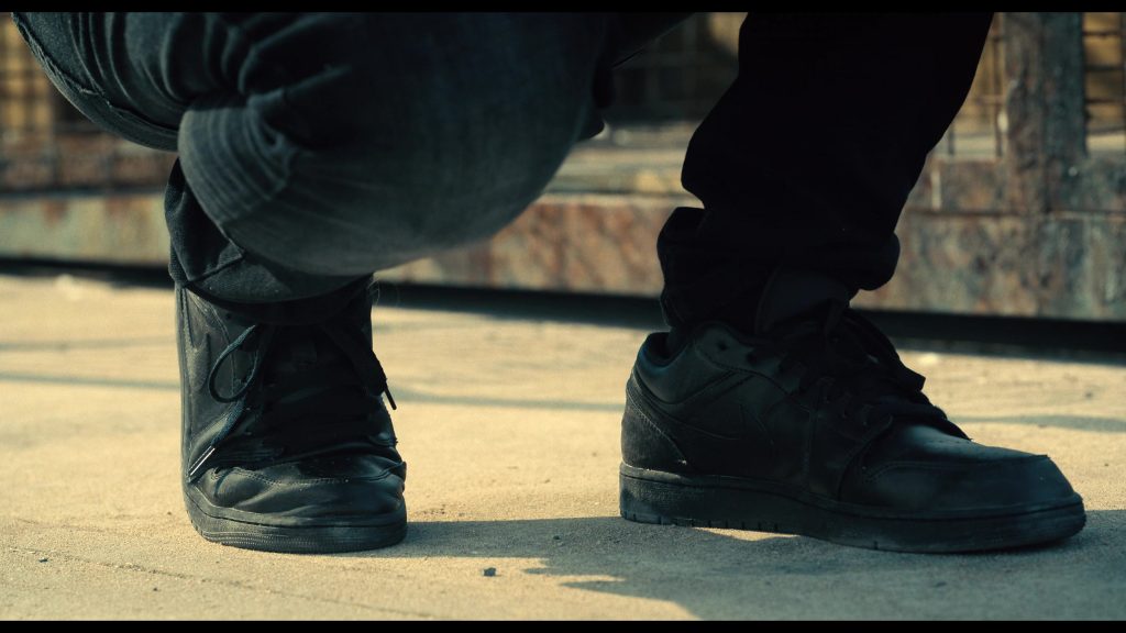 Nike Shoes in The Killer (2024) (Image 1)