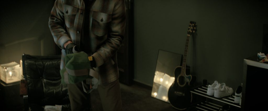 Nike Sneakers in A Working Man (2025) (Image 2)