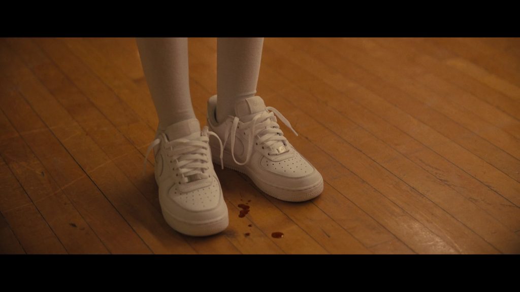 Nike Sneakers in The Deliverance (2024) (Image 1)