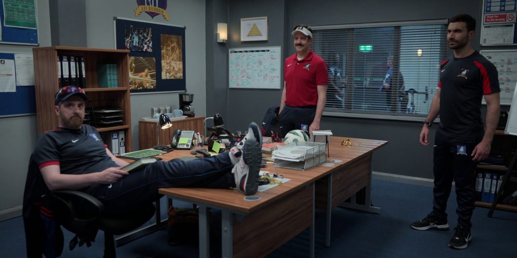 Nike Sportswear, New Balance and Nike Shoes in Ted Lasso S03E10 “International Break” (2023) (Image 1)