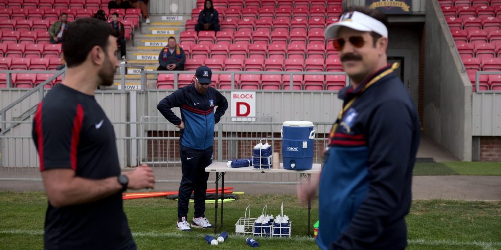 Nike Tracksuit and New Balance Sneakers of Brendan Hunt as Coach Beard and Igloo Cooler in Ted Lasso S03E07 “Boxes” (2023) (Image 1)