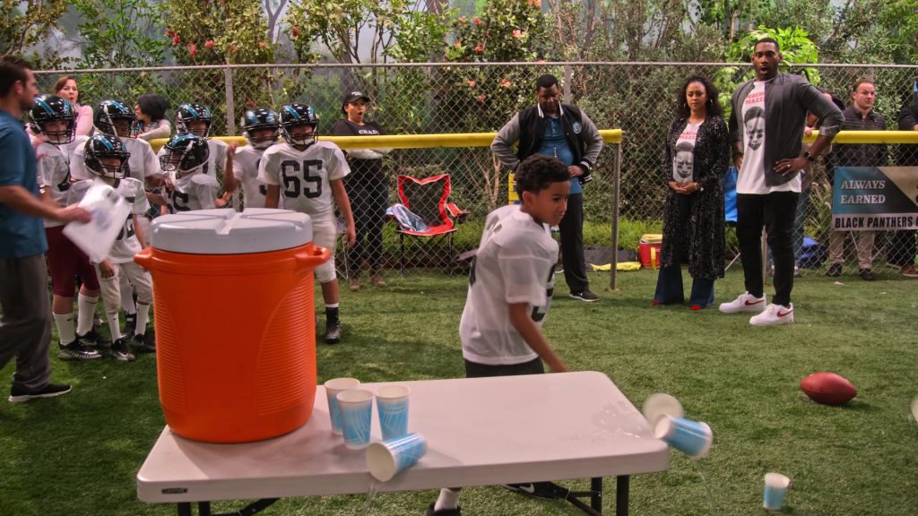 Nike White Sneakers With Red Logo Worn by Anthony Alabi in Family Reunion – Season 1 Episode 8, “Remember Macho Mazzi” (2019) (Image 1)