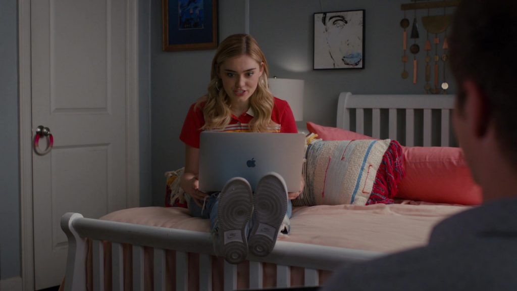 Nike Women's Shoes and Apple MacBook Laptop of Meg Donnelly as Taylor Otto in American Housewife S05E01 “Graduation” (2020) (Image 1)