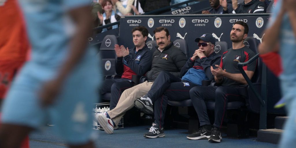 Nike and New Balance Shoes, Nissan, Etihad Airways, Puma in Ted Lasso S03E11 “Mom City” (2023) (Image 1)