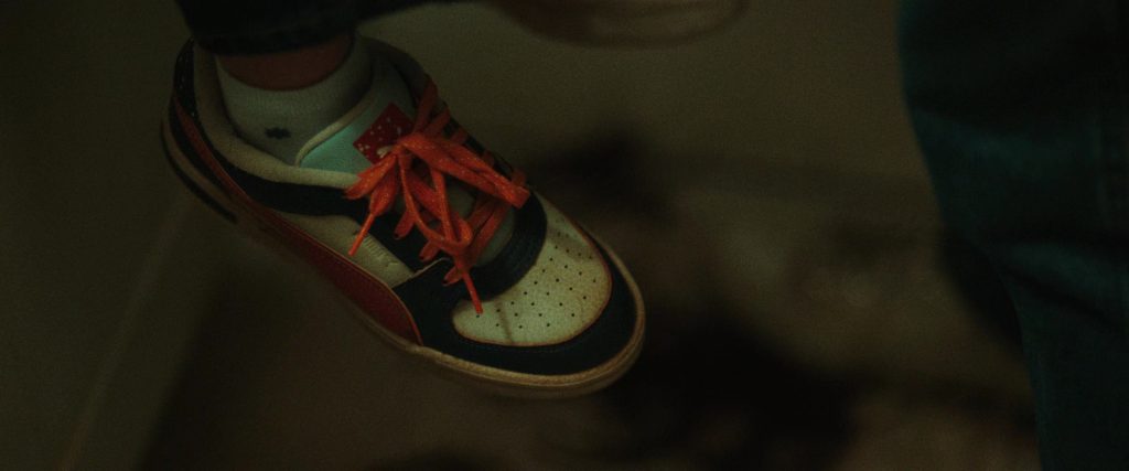 Puma (Scene 1) Shoes in She Rides Shotgun (2025) (Image 1)