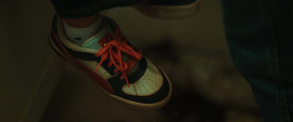 Puma (Scene 1) Shoes in She Rides Shotgun (2025) (Image 2)