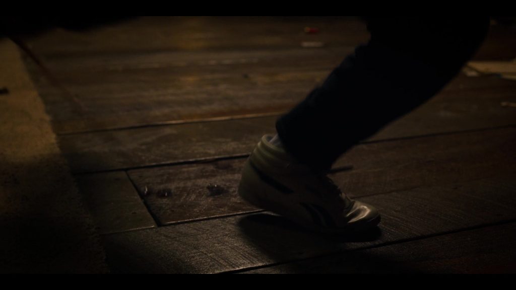 Reebok Freestyle High Top White Sneakers Worn by Millie Bobby Brown as Eleven aka Jane Hopper in Stranger Things – Season 3, Episode 7, “The Bite” (2019) (Image 1)