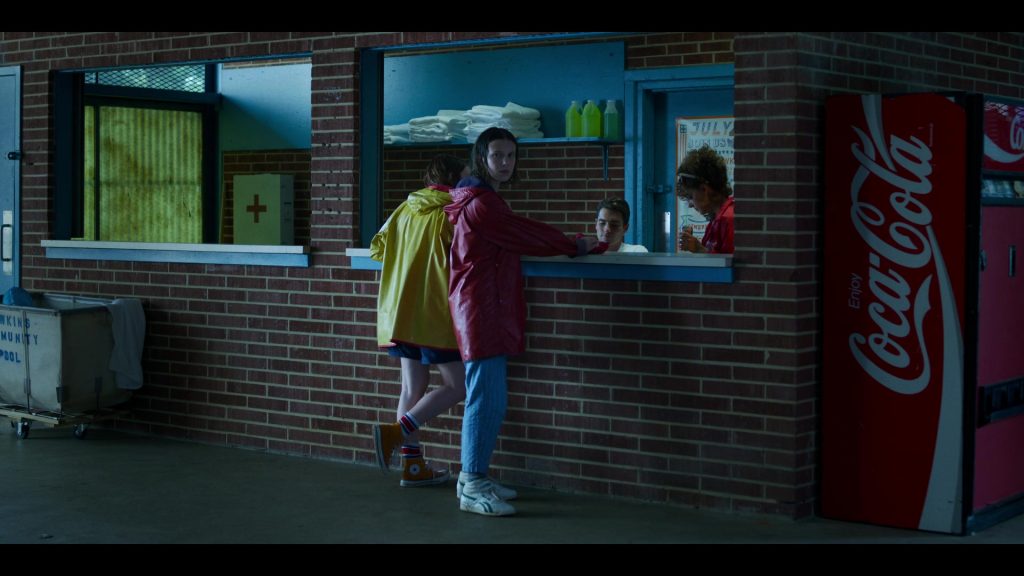 Reebok Sneakers Worn by by Millie Bobby Brown, Converse Shoes Worn by Sadie Sink and Coca-Cola Vending Machine in Stranger Things – Season 3, Episode 3, “The Case of the Missing Lifeguard” (2019) (Image 1)