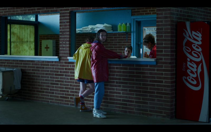 Reebok Sneakers Worn by by Millie Bobby Brown, Converse Shoes Worn by Sadie Sink and Coca-Cola Vending Machine in Stranger Things – Season 3, Episode 3, “The Case of the Missing Lifeguard” (2019) (Image 1)