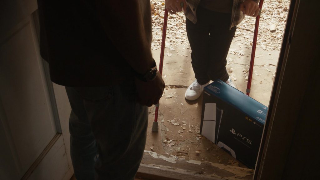 Sony PS 5 and Nike Shoes in 9-1-1 S08E12 “Disconnected” (2025) (Image 4)