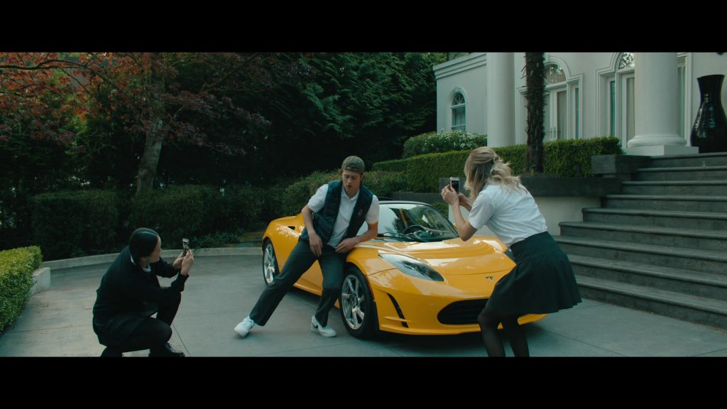 Tesla Car and Nike Sneakers in Bad Genius (2024) (Image 3)