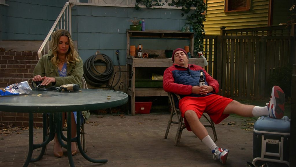 UTZ Chips, Puma Men's Sneakers and Miller Lite Beer Held by Eric Petersen in Kevin Can Fk Himself S01E03 “We're Selling Washing Machines” (2021) (Image 1)