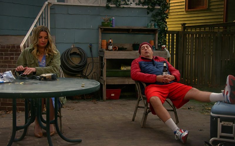 UTZ Chips, Puma Men's Sneakers and Miller Lite Beer Held by Eric Petersen in Kevin Can Fk Himself S01E03 “We're Selling Washing Machines” (2021) (Image 1)