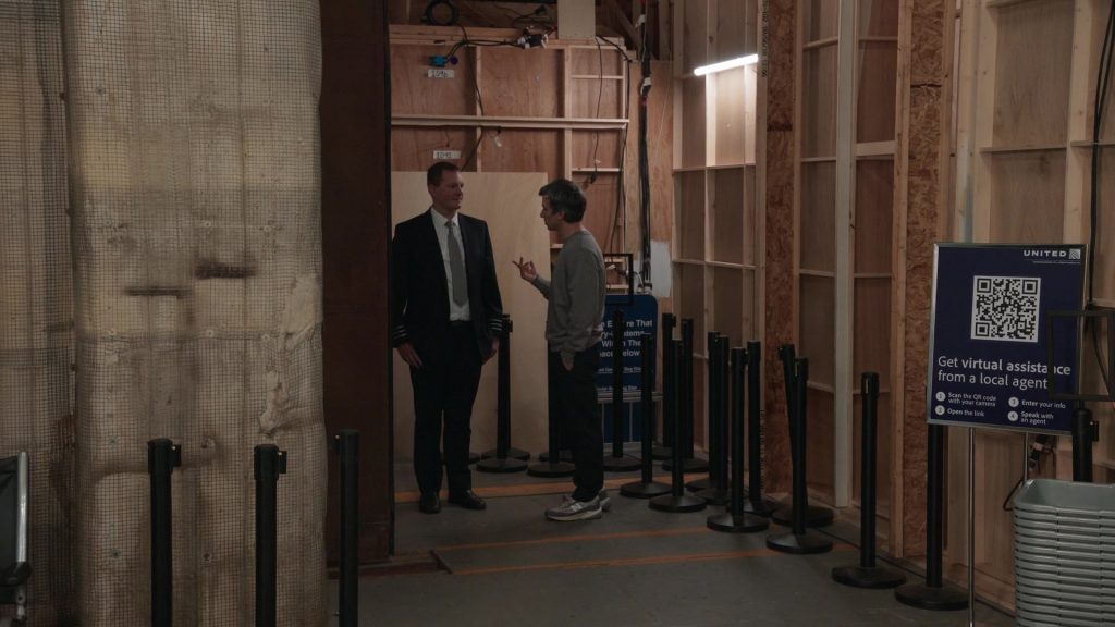 United Airlines, New Balance Sneakers in The Rehearsal S02E04 “Kissme” (2025) (Image 1)