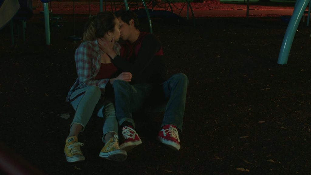 Vans Red Sneakers of Xolo Maridueña as Miguel Diaz and Converse White Shoes of Peyton List as Tory in Cobra Kai S02E05 “All In” (2019) (Image 1)