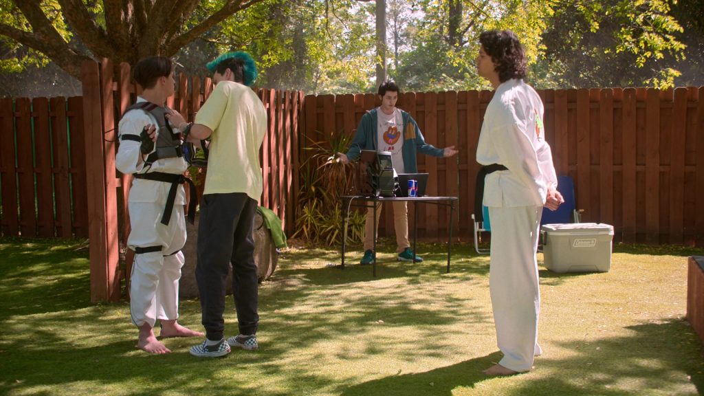 Vans Sneakers, Red Bull Energy Drinks, Coleman Cooler in Cobra Kai S06E12 “Rattled” (2025) (Image 1)