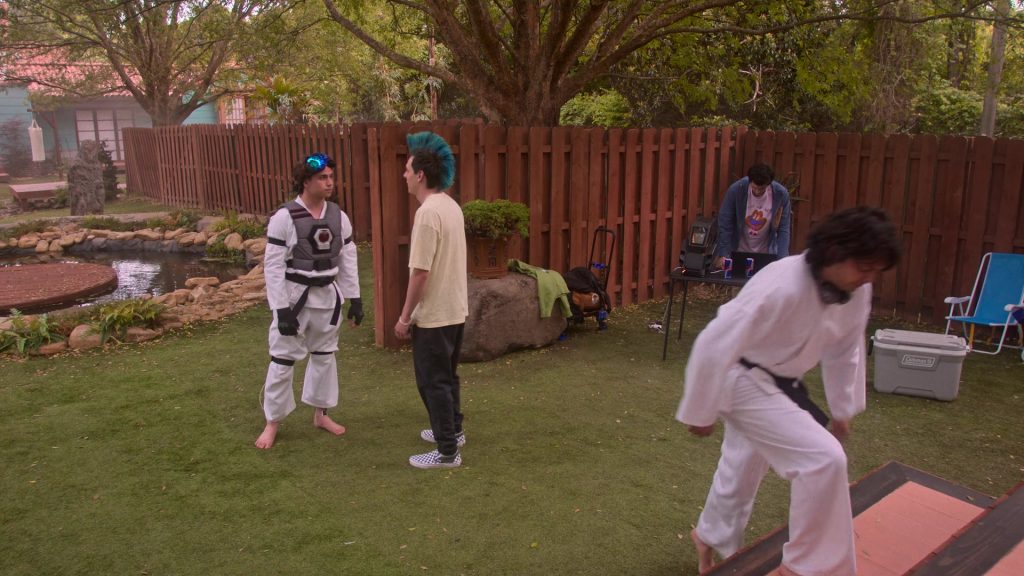 Vans Sneakers, Red Bull Energy Drinks, Coleman Cooler in Cobra Kai S06E12 “Rattled” (2025) (Image 3)