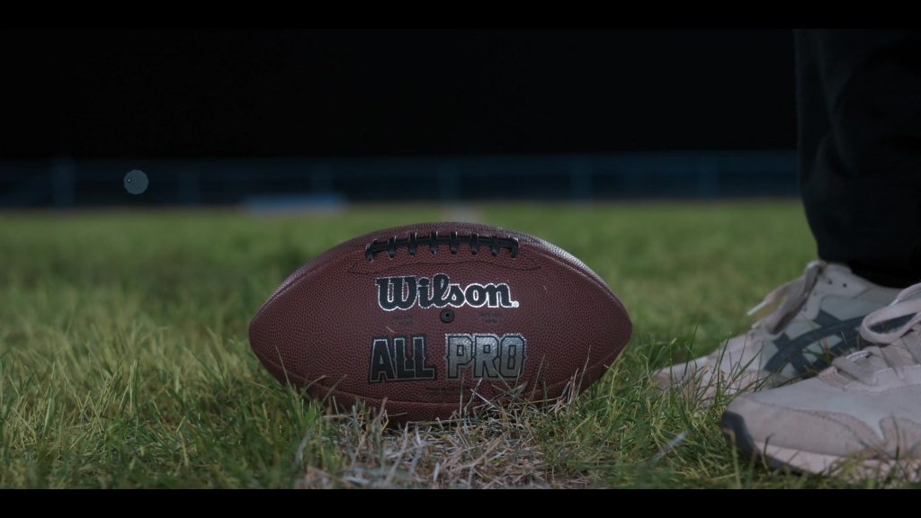 Wilson NFL Ball, Asics Shoes in My Life with the Walter Boys S02E04 “No-look Pass” (2025) (Image 1)